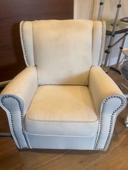 Beautiful Nursery Rocking Chair for Sale 🤍  Elegant cream-colored upholstered nursery chair with beautiful silver nailhead trim. Comfortable, stylish