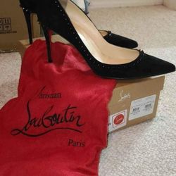 Women's black spiked Christian Louboutin heels. Size 9/39.