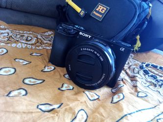 A6100 oss lense 300$