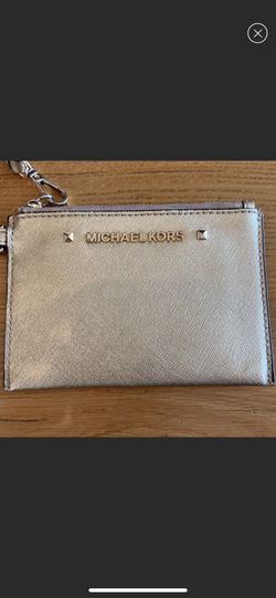 Michael Kors small gold wristlet.