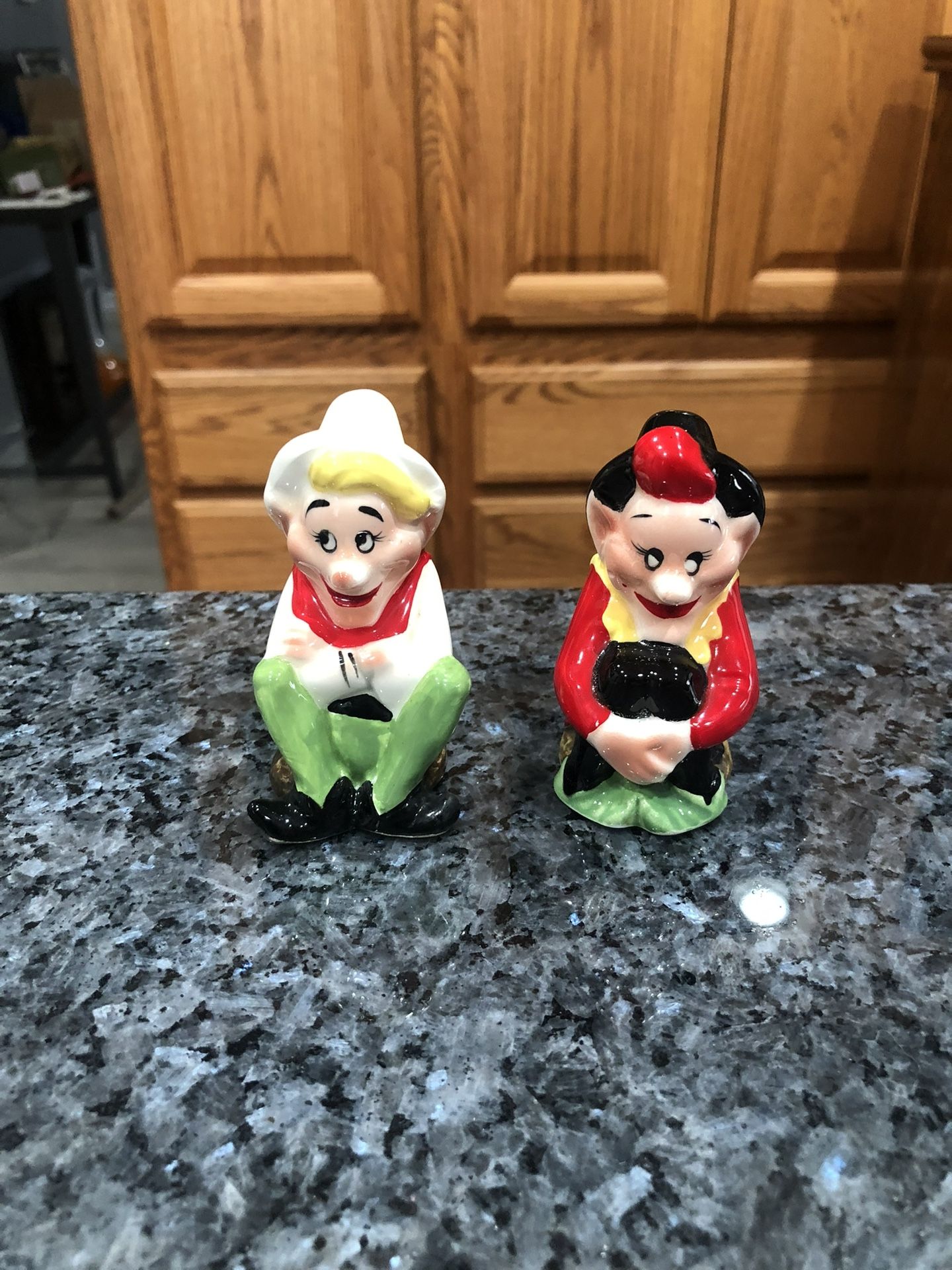 Elf Pixie Salt And Pepper Shakers Victoria Ceramics. One cork stopper is missing.  Made in Japan Pixies.  Preowned good condition.