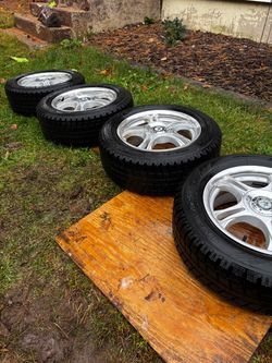 Set of 4 Tires on Silver Alloy Wheels