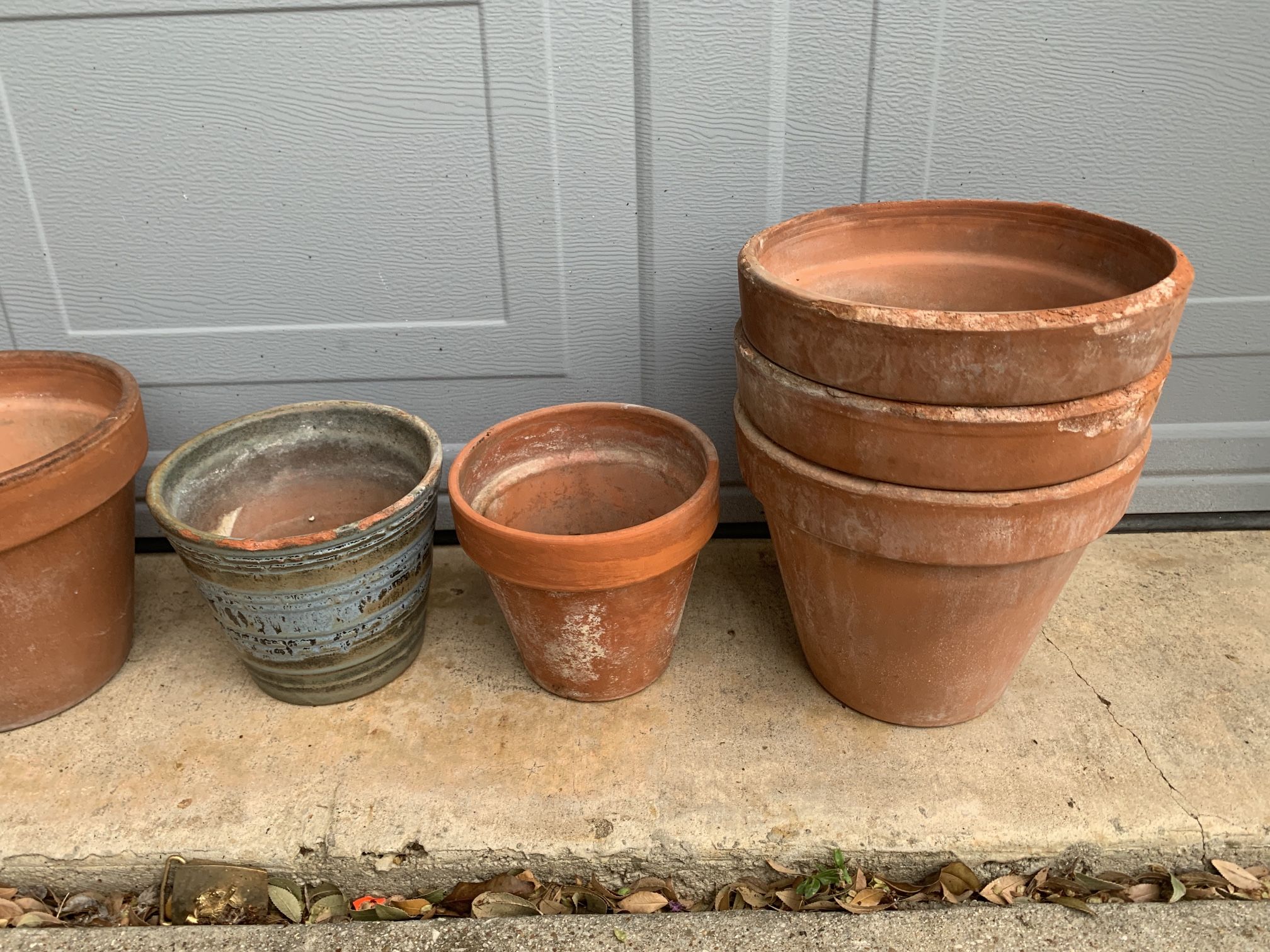 Clay flower pots five dollars each. The largest ones are 7 3/4 inches tall 8 1/2” wide 
