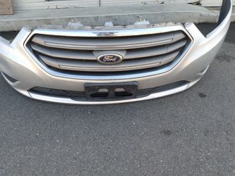 2013-2018 Ford Taurus complete front bumper with All the accessories oem.