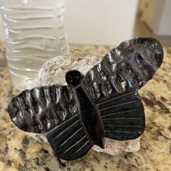 Choice:  Art Fair: Stone Butterfly Resting on Rock