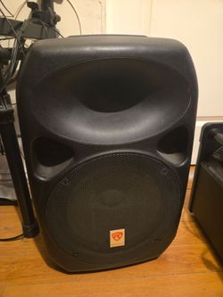 black Rockville Power Gig RPG-122K powered PA speaker featuring a 12-inch woofer and horn tweeter
