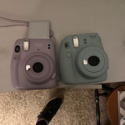 Two Fuji film cameras 