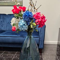 Blue Glass Vase With Flower Arrangement 