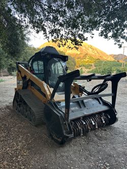 Skid steer bobcat land clearing