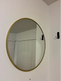 Gold trim circle mirror