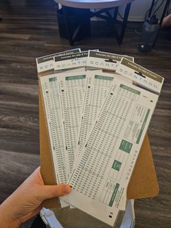 Scantron 882-E answer sheets (standard green half-sheet, 100-question testing forms)