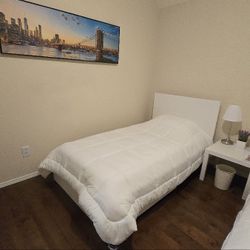 One Twin Bed With 2 Sets of Blankets And Bed Sheets