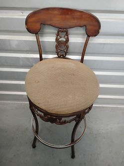 Vintage-Style Metal and Wood Swivel Bar Stool.