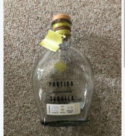 Empty Partida Reposado bottle