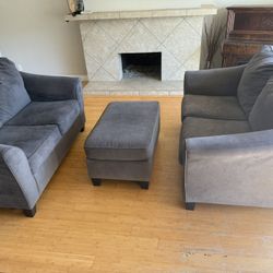 Two Grey Love Seats And Ottoman 
