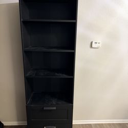Black shelf with drawers
