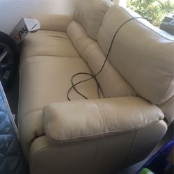 Leather Couch With Automatic Recliner For Legs And Back  Control Is On Inside For Easy Access  Very Comfortable To Sit Or Sleep On  