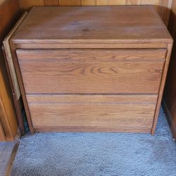 Two drawer wood file cabinet.