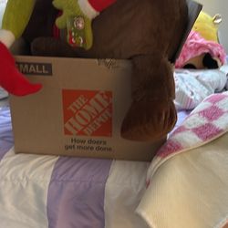 Two Christmas plushy’s and a box of old items