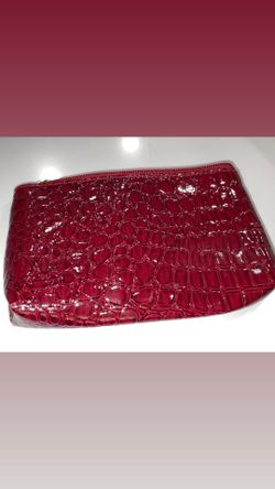 red faux crocodile-embossed cosmetic makeup bag