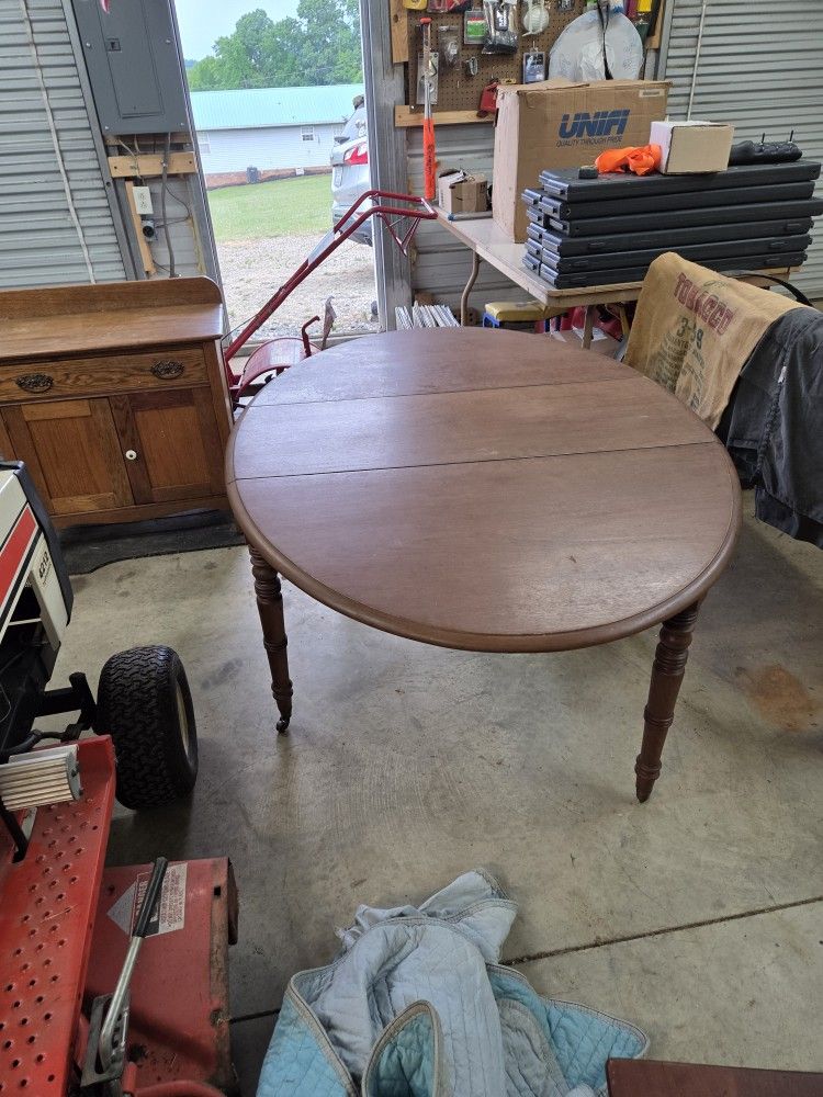 Vintage/antique Drop Leaf Table soild wood great finish oval shape i think it's cherry or mahogany in excellent condition solid and finish