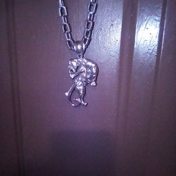 Mans Silver Chain  With Man Carrying A Bob Cat