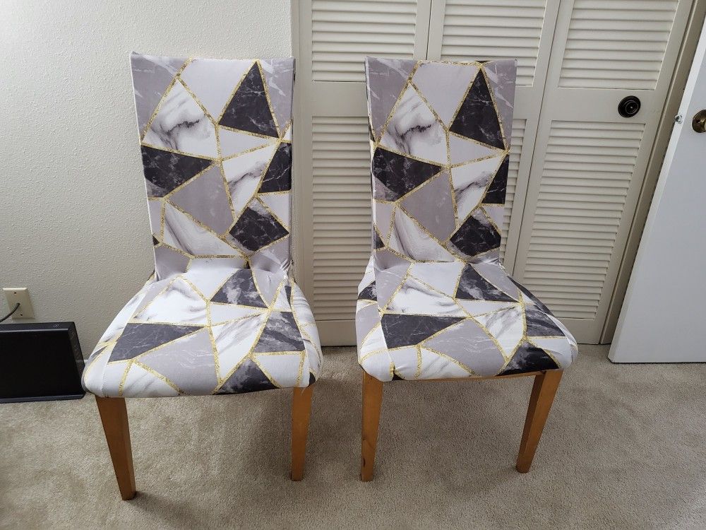 Two Chairs With Their Covers