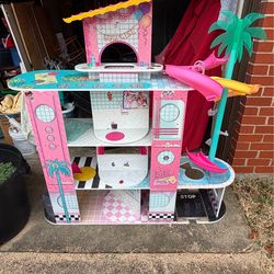 DOLL HOUSE. 48"w x 12"deep x 50 1/2"high; cross streets are Arapaho & Waterview