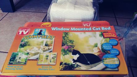 Cat window bed . brand new in box. Also. Calendar