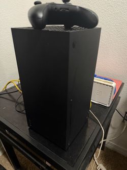 Series x console with box and controller