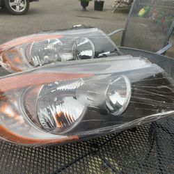 E90 BMW Headlight Assembly  (passenger.)