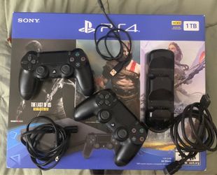 PS4 with 2 controllers, docking station, and cables