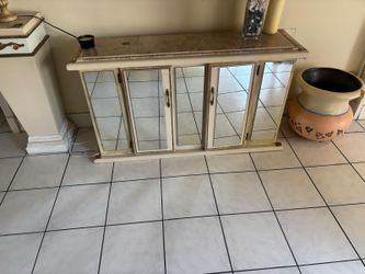 Vintage marble top and mirrored entry way condole …55” wide , 16” depth, 30” high $80 Will not last