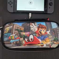 Nintendo Switch Console with Gray Joy-Con. 