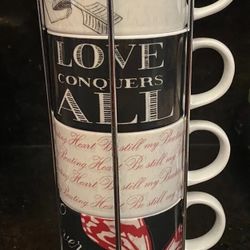 Pier 1 Imports stackable porcelain coffee mugs with a metal rack.