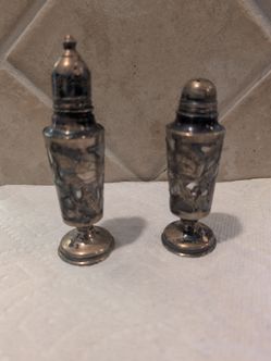vintage Sterling Art Deco Silver Overlay Floral Engraved Salt and Pepper Shakers, featuring glass liners covered in an intricate silver floral pattern