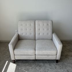 Small beige reclining couch