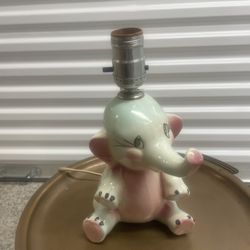 Vintage Tot Line Dumbo Style Elephant Table Lamp located near the Miami Design District and measures 7” d x 6” w x 9.75” h 