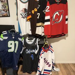 7 Jerseys - Devils, Seahawks, Rangers, Pistons, Magic, Penguins, Padres