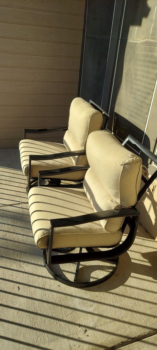 Two Outdoor Swivel Chairs and Covers