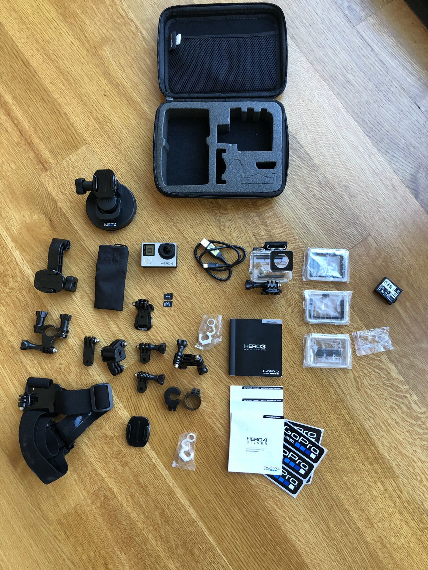 GoPro HERO 4 Silver Bundle With 4 & 8 gb SD, Dual Bat/charger, Padded Case. Two batteries and also a separate charger.