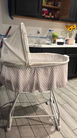 White and purple Bassinet with night light and music