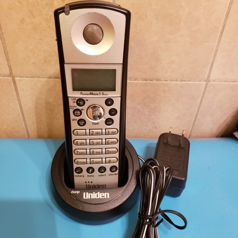 Uniden 5.8 ghz cordless phone handset and charging station compatible with tru5860 tru5885 tru5865 tcx580. Good clean working condition. No Battery.