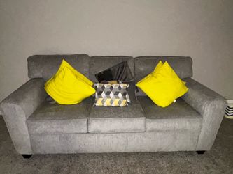 Couch with pillows and rug