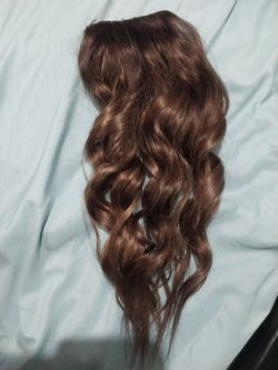 This Is A Ponytail Clip-on From Irresistible Me Brand  16 Inch Natural Remy Hair 138 G Of Hair Very Soft And Beautiful