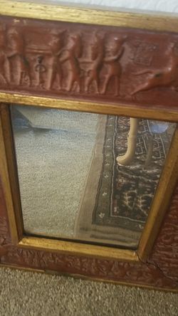 Great mirror w decorative design around it