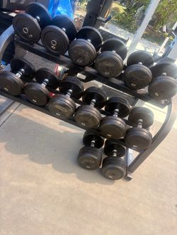Cap rubber coated dumbbells in good condition and rack 15 up to 50 but messing 40s   All in good condition pick up in sun valley cash only