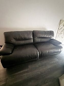 Leather couch and large modern wall art