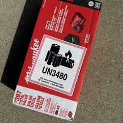 Milwaukee Charger And 2 Batteries 