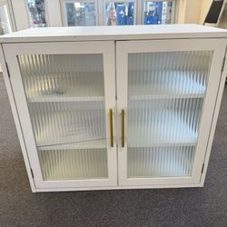 Wood White Wall cabinet with glasses. Magnetic door cabinet with two shelf.  $90 brand new 